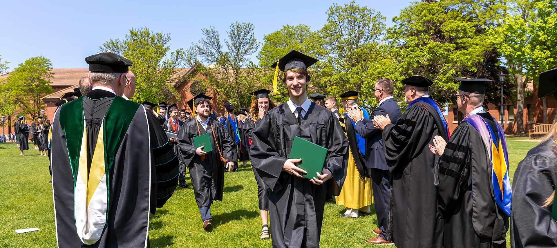 2023 grad with diploma